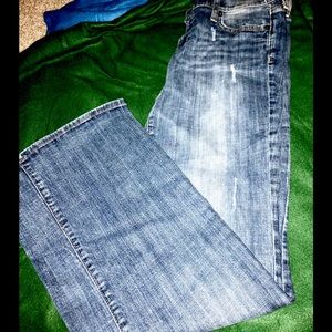 Distressed flare jeans.                          1